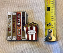 Load image into Gallery viewer, Movie Night Needle Minder horror VHS tapes and movie popcorn
